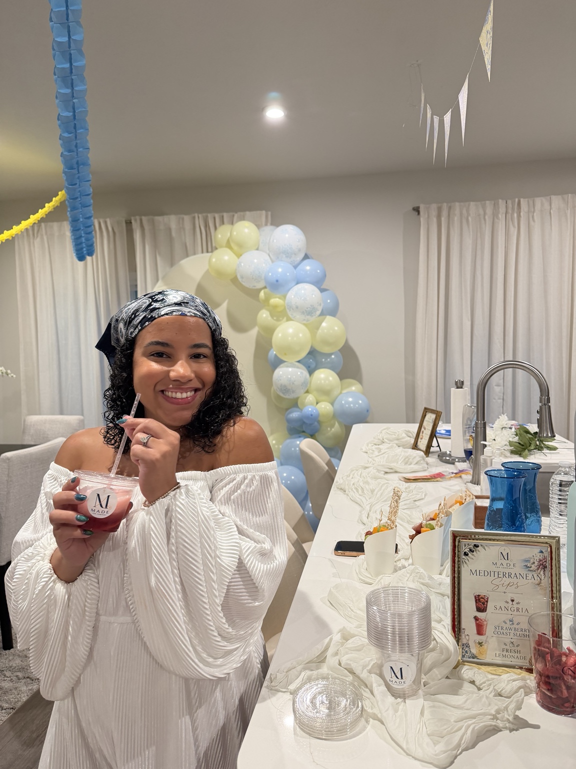 Keirys welcoming guests beside the Mediterranean Sips bar at a Made for Company gathering